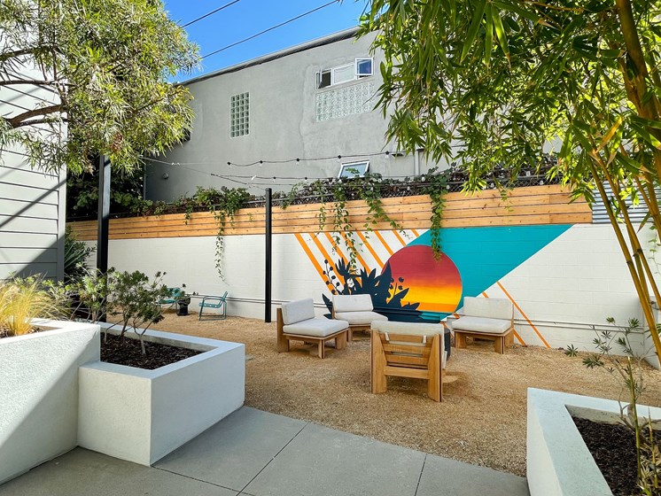 Outdoor Seating with mural on wall
